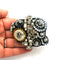 Mathew Williamson Applique Brooch in black silver and gold.