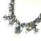 iridescent blue rhinestone necklace in white metal by Sherman from the 1950s 