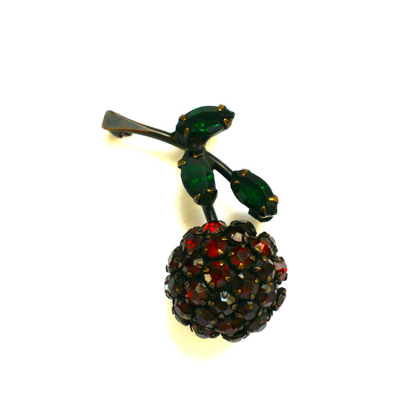 Vintage berry brooch by Warner in black metal with dark red and bright green claw set stones