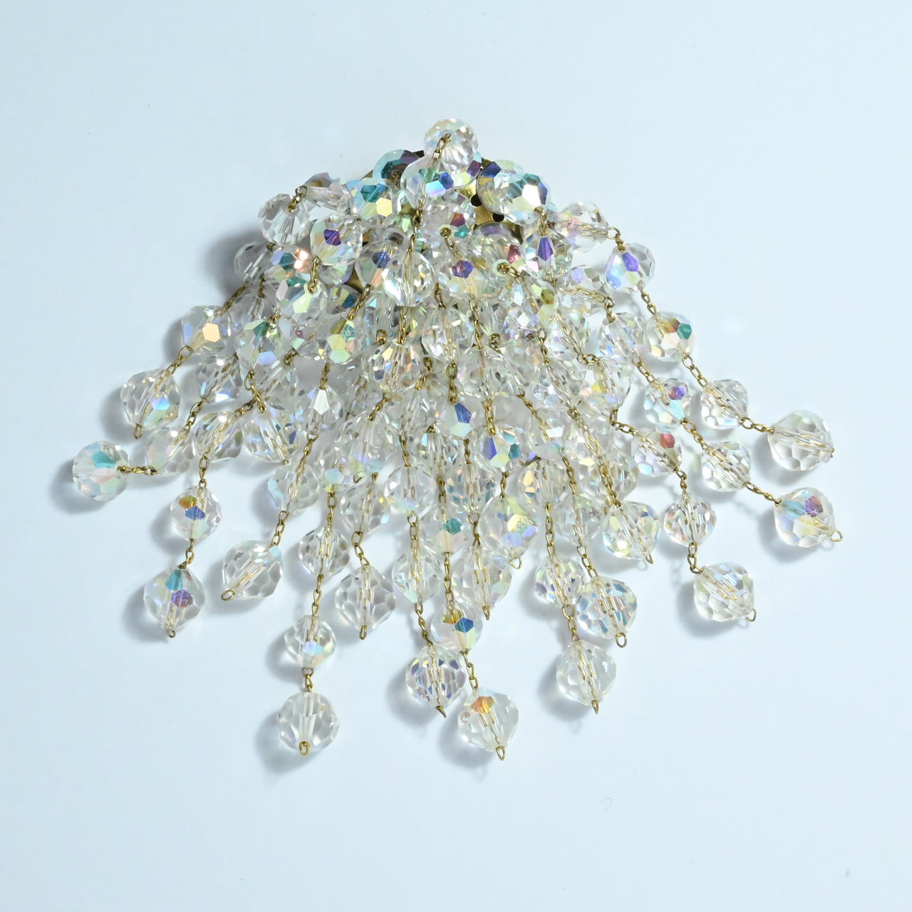 Lovely cascading waterfall brooch in aurora borealis crystal Made in Austria in circa 1960s