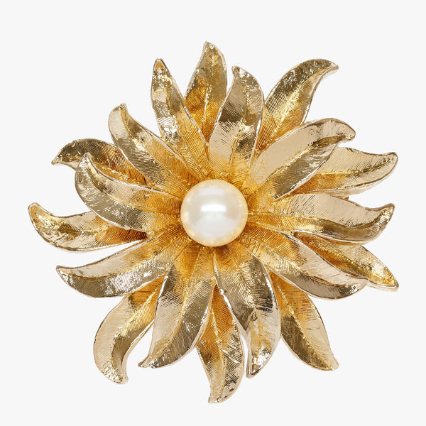 Lovely gold plated floral brooch with one faux pearl at the centre